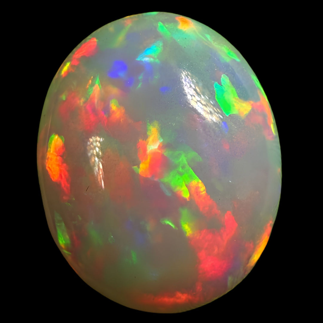 7.57ct AAA quality Natural Ethiopian Welo Opal – Oval Cabochon – Fiery Red, Neon Green & Electric Blue Fire – Rolling Broadflash Pattern – AAA Collector Grade