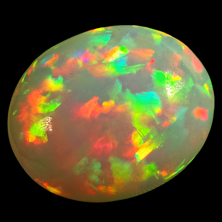 7.57ct AAA quality Natural Ethiopian Welo Opal – Oval Cabochon – Fiery Red, Neon Green & Electric Blue Fire – Rolling Broadflash Pattern – AAA Collector Grade
