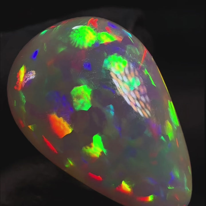 9.88ct AAA quality Natural Ethiopian Welo Opal – Pear Cabochon – Neon Green, Fiery Red & Electric Rainbow Fire – Floral Honeycomb Pattern – AAA Collector Grade