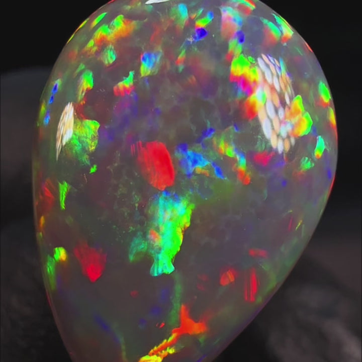 8.5ct AAA quality Natural Ethiopian Welo Opal – Pear Cabochon – Fiery Red, Neon Green & Sunset Orange Fire – Honeycomb Floral Pattern – AAA Collector Grade