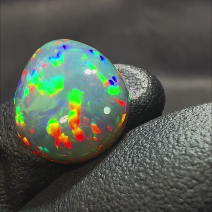 8.39ct AAA quality Natural Ethiopian Welo Opal – Pear Cabochon – Neon Green, Fiery Red & Electric Blue Fire – Broadflash Honeycomb Pattern – AAA Collector Grade