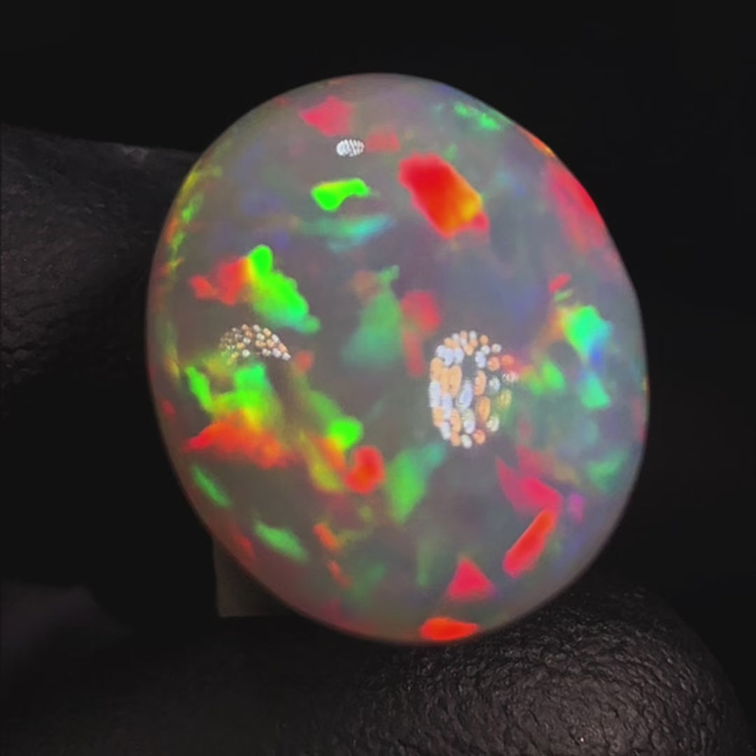 7.57ct AAA quality Natural Ethiopian Welo Opal – Oval Cabochon – Fiery Red, Neon Green & Electric Blue Fire – Rolling Broadflash Pattern – AAA Collector Grade